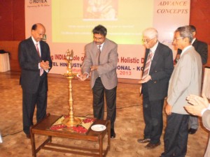Timir Baran Samanta, ISA Kolkatta section president, lights the inaugural lamp. On left is K. Nandakumar, chairman of the Confederation of Indian Industries, Instrumentation and Automation Division. Third from left is N.C. Mukherjee, ISA Kolkatta section alternate society delegate.