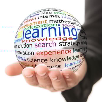 Transparent ball with inscription learning in a hand