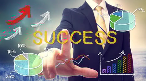 Bussinessman pointing at SUCCESS